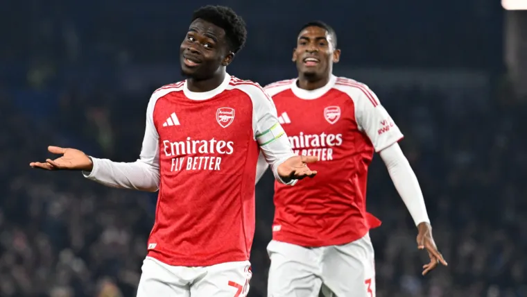 Bukayo Saka shrugs in celebration after scoring an Arsenal goal